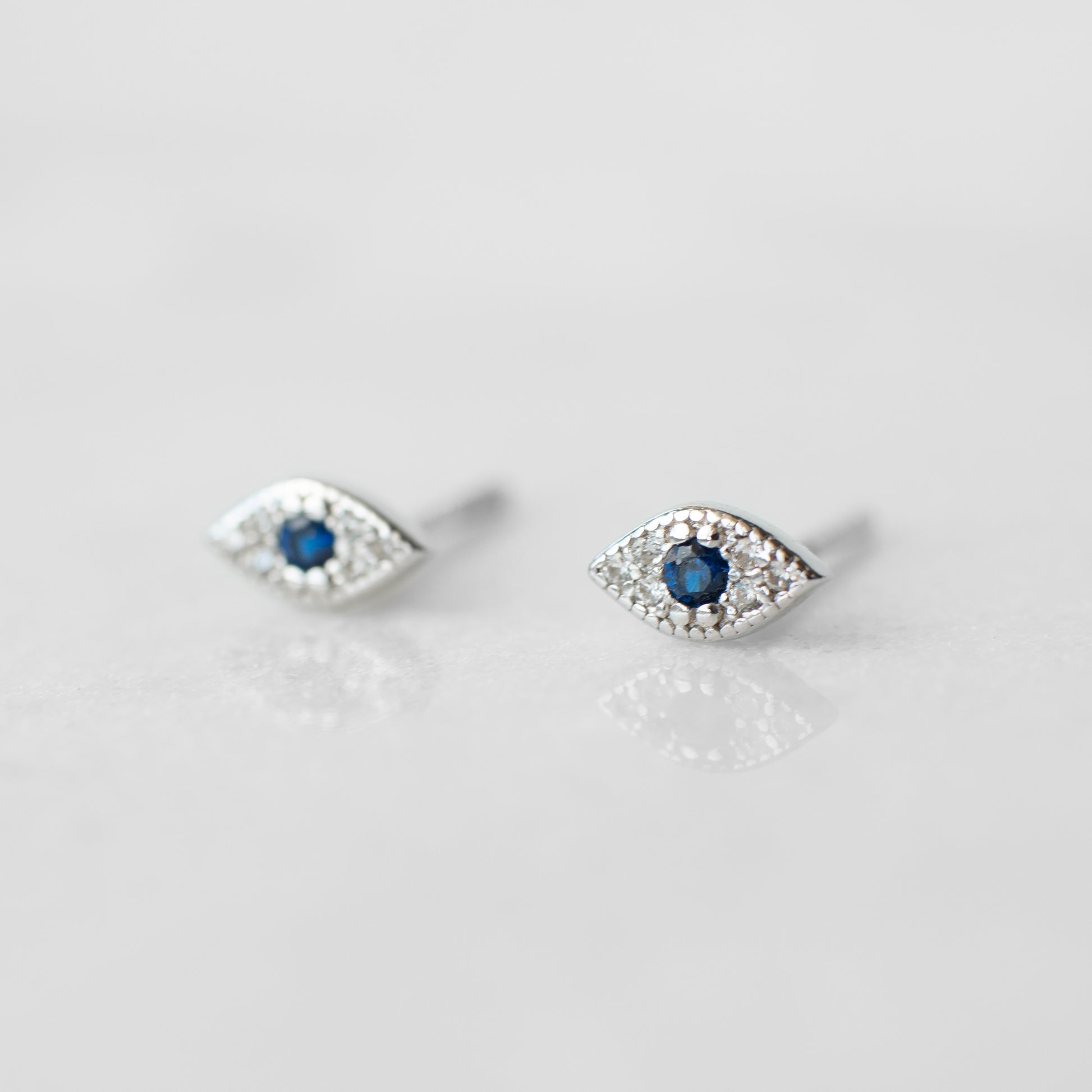 Tiny evil eye sterling silver earrings