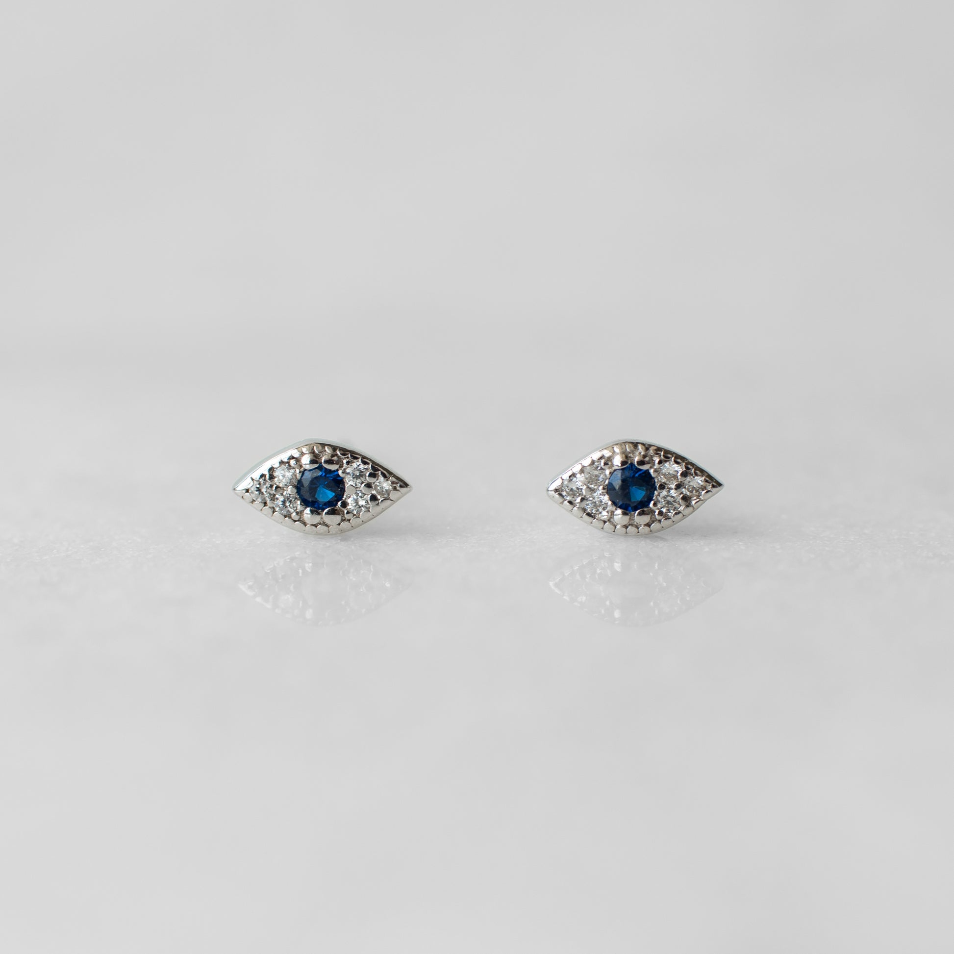 Tiny evil eye sterling silver earrings