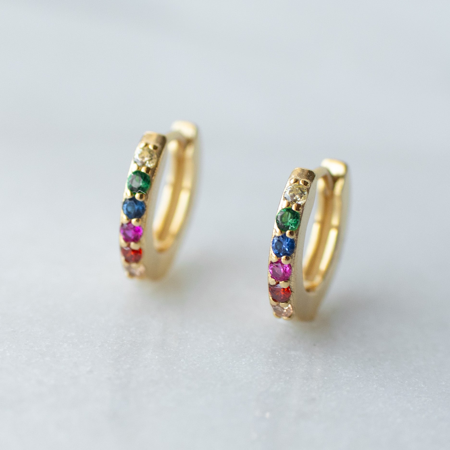 Rainbow huggie hoops in gold