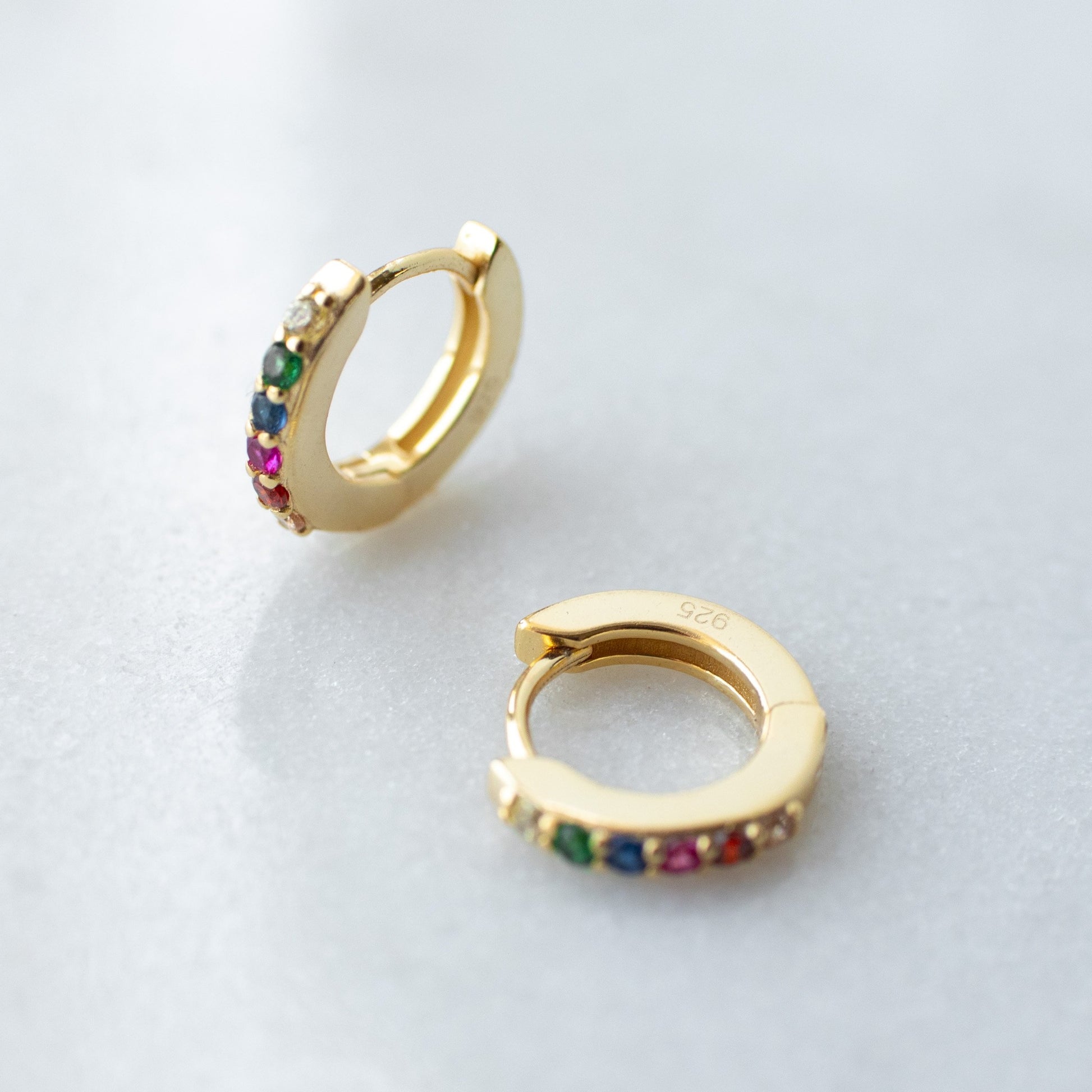 Rainbow huggie hoops in gold